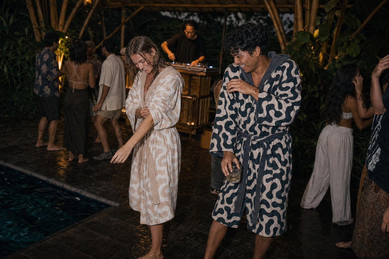 Friends dancing after a swim in Samudra towel kimonos